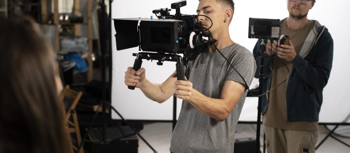 man-filming-with-professional-camera-new-movie